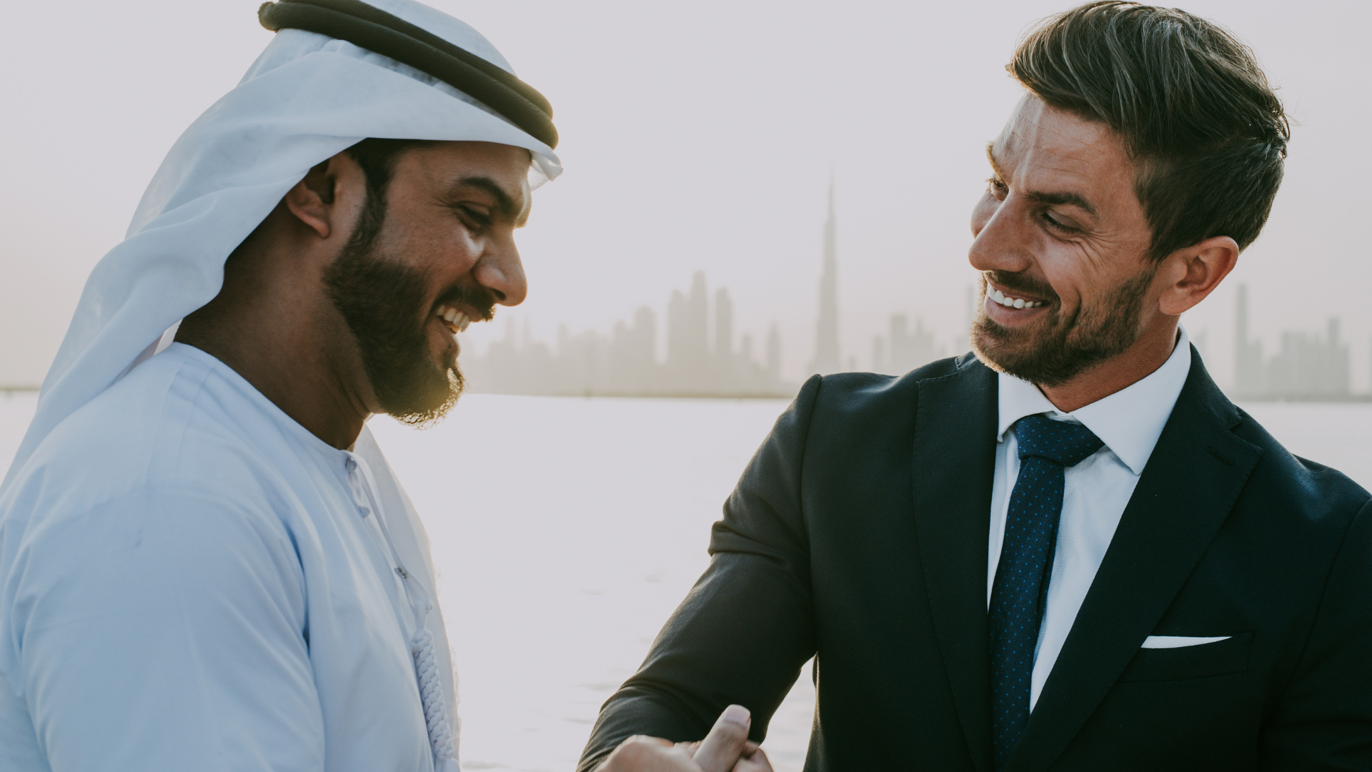 Arab Man and Occidental Man in Dubai Shaking Hands